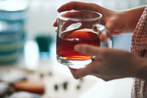Tea in hand, gentle Stock Photos