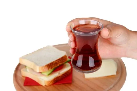 Tea on Hand with Sandwich Stock Photos