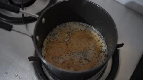The tea is heating in the pot on the gas Stock Footage 246594858