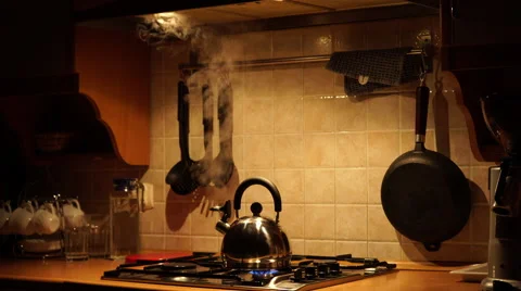 Tea kettle with boiling water on gas stove, Stock image