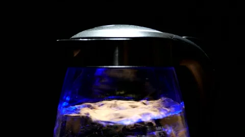 Tea kettle with boiling water on a black background Video stock 59902151