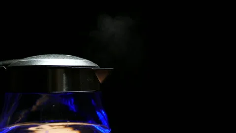Tea kettle with boiling water on a black background with 4k resolution Video stock 141120826