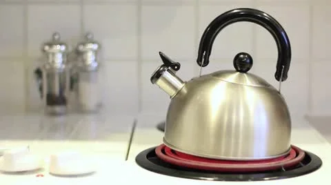 Tea Kettle on Burner Steams Stock Footage 18193385