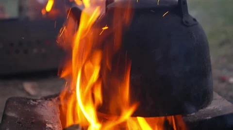 Tea Kettle on Campfire in Camping Видео 65287066