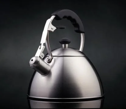 Tea kettle over dark background Foto stock