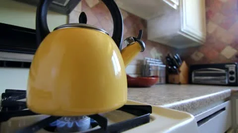 Tea Kettle on Stovetop Stock Footage