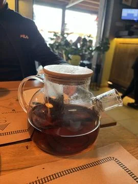 Tea kettle on the table in the coffee shop Stock Photos