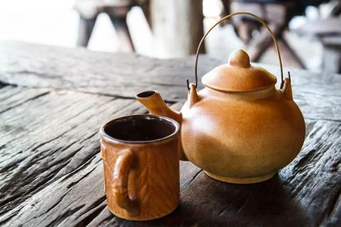 Tea kettle on wood table Stock Photos