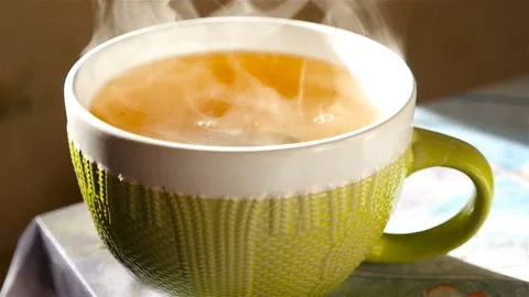 Tea in a large cup. Transparent steam. Slow motion Stock Footage 91583204