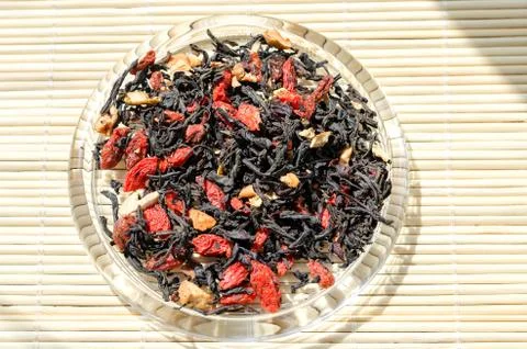 Tea leaf with Goji berries Stock Photos