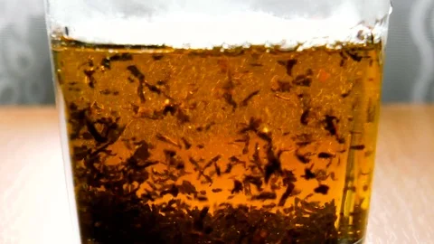 Tea leaves are boiled in boiling water Stock Footage 79851953