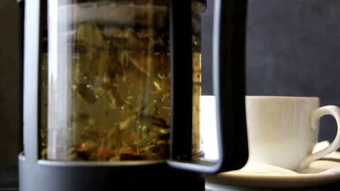 The tea leaves are disclosed in boiling water Stock Footage 96572018