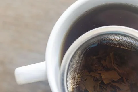 Tea leaves in a filter inside a cup, Majorca, Balearic Islands, Spain Stock Photos