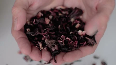 Tea leaves in the hands of a close-up in slow motion Stock Footage 156258961