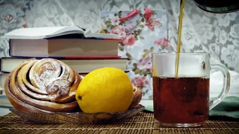 Tea with lemon and fresh pastries Stock Footage 105706435