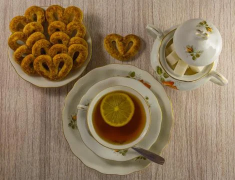 Tea with lemon and sweets Stock Photos