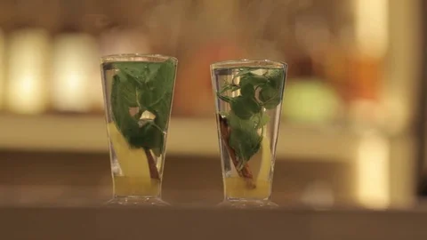 Tea with lemon, ginger and mint in a beautiful glass cup. Stock-Footage 82082660
