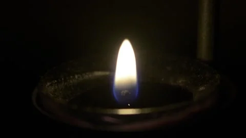 Tea-Light Candle Being Blown Out | Black Background Stock Footage