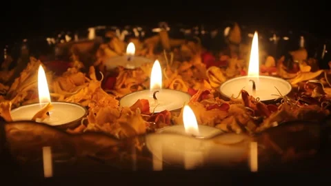 Tea light candles and marigold flower petals Stock Footage 164526826