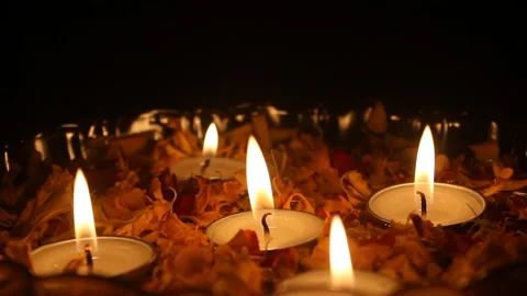 Tea light candles and marigold flower petals Stock Footage 164527125