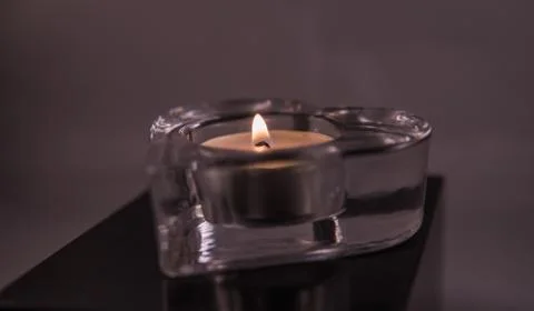 Tea light in a heart form Stock Photos