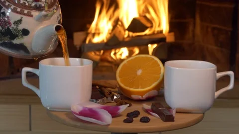 Tea. A man pours tea from a teapot into cups standing on a small table . Stock-Footage 150309655