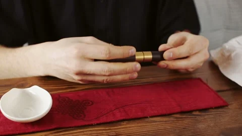 Tea master with instrument at tea ceremony Stock Footage 139329733