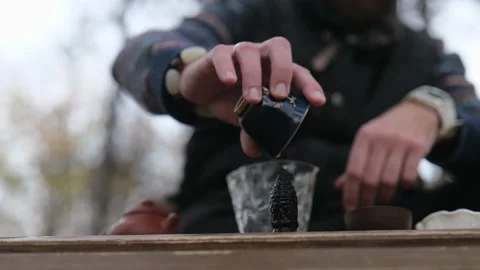 Tea master pours tea on a tea figurine. outdoors tea ceremony Stock Footage 229860715