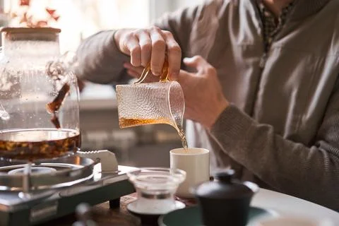 Tea master pours white tea to guests. Everything is ready for the tea ceremony Stock Photos