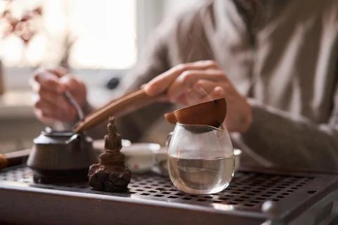 Tea master pours white tea to guests. Everything is ready for the tea ceremony Stock Photos