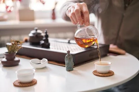 Tea master pours white tea to guests. Everything is ready for the tea ceremony Stock Photos