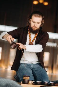 The tea master is preparing to hold a tea ceremony in the interior Stock Photos