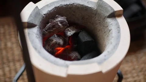Tea master preparing hot coals at clay stove for chinese tea ceremony. 4k Stock Footage 113401355