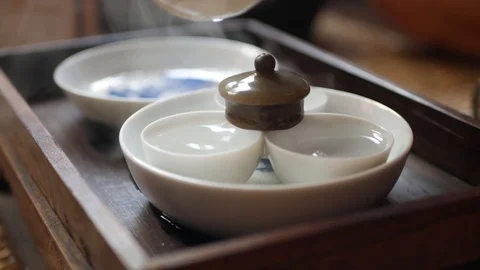Tea master washes and warms tea cups before the tea ceremony. Traditional Video stock 113401146
