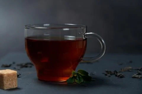 Tea with mint and lemon on a dark background Stock Photos