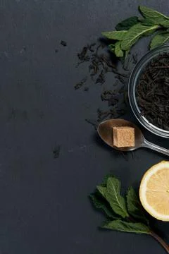 Tea with mint and lemon on a dark background Stock Photos