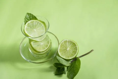 Tea with mint and lime, with a calming effect, green still life close-up Stock Photos