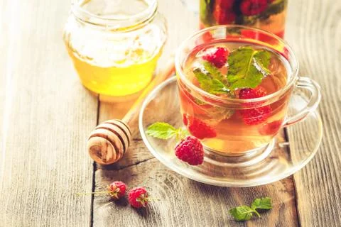 Tea with mint and raspberry Stock Photos