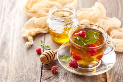 Tea with mint and raspberry Stock Photos