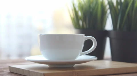 Tea mug is standing on the balcony Stock Footage 68970192