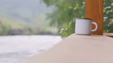 Tea mug is standing on the balcony. Stock-Footage 131140449