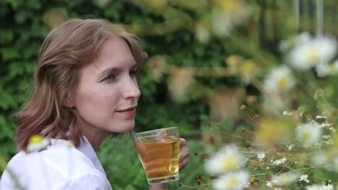 Tea in nature. Close-up. Rack focus. Stock Footage 153310933