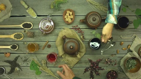 Tea on an old wooden table. Flat lay. Video stock 156328418