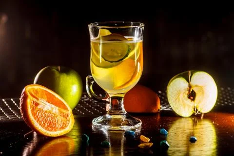 Tea or lemonade from apples, oranges and cucumbers in a glass Cup. Stock Photos