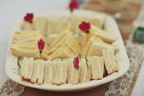 Tea parties wont be the same without a sandwich snack. triangular sandwiches on Stock Photos