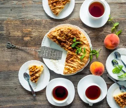 Tea with peach pie Stock Photos