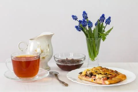 Tea with pizza Stock Photos