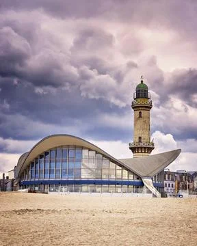 Tea pot and lighthouse on the beach in Warnemünde. Stock Photos