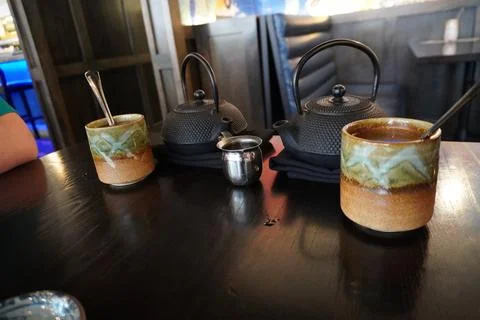 Tea pot with two cups Stock Photos