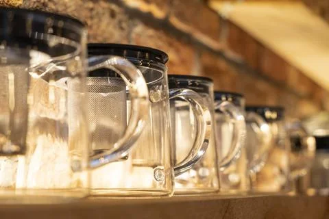 Tea pots lined up on the shelf Stock Photos